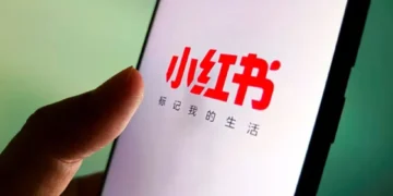 Xiaohongshu app logo displayed on smartphone screen in Taiwan - VCG/AP