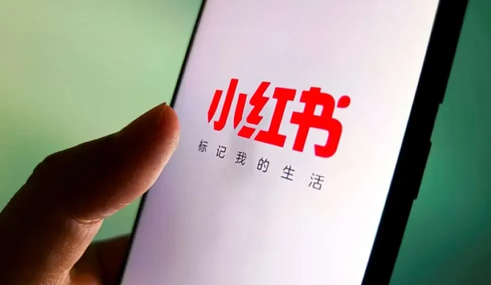 Xiaohongshu app logo displayed on smartphone screen in Taiwan - VCG/AP