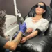 Laser treatment removing tattoo ink from forearm - AP Photo/Corey Williams