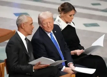 Video frame showing altered meme depicting Obamas as primates online - AP Photo/Jacquelyn Martin, File