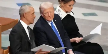 Video frame showing altered meme depicting Obamas as primates online - AP Photo/Jacquelyn Martin, File