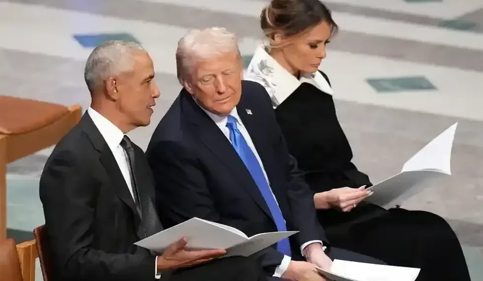 Video frame showing altered meme depicting Obamas as primates online - AP Photo/Jacquelyn Martin, File