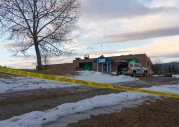 Police vehicles surround Tumbler Ridge school after deadly shooting - Jesse Boily /The Canadian Press via AP