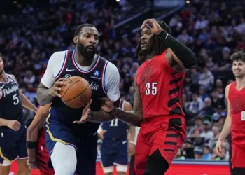 Andre Drummond reacts after three-pointer against Sacramento Kings bench - AP Photo/Matt Rourke