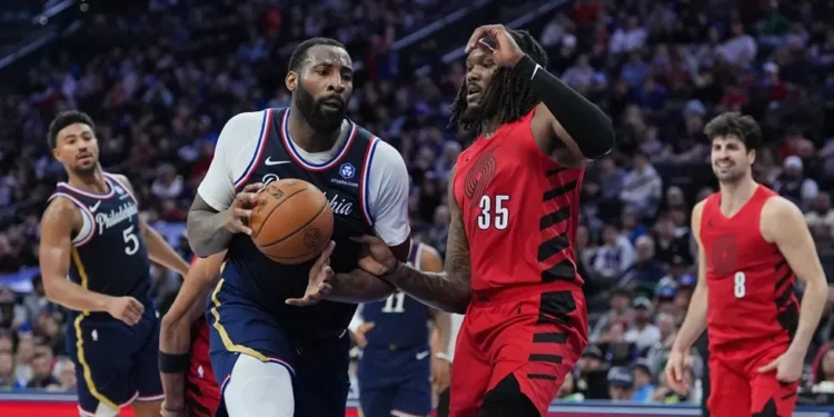Andre Drummond reacts after three-pointer against Sacramento Kings bench - AP Photo/Matt Rourke