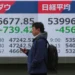 Asian stock market boards reacting to oil price volatility and geopolitical tensions - AP Photo/Eugene Hoshiko