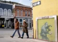 Street art mural associated with Banksy highlighting anonymity debate - AP Photo/Chris Pizzello, File