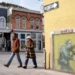 Street art mural associated with Banksy highlighting anonymity debate - AP Photo/Chris Pizzello, File