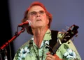 Country Joe McDonald performing anti-war anthem at Woodstock festival - AP Photo/Craig Ruttle, File