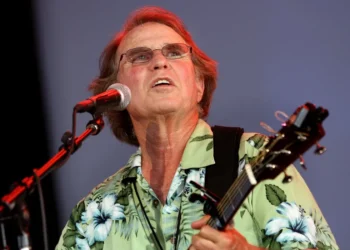 Country Joe McDonald performing anti-war anthem at Woodstock festival - AP Photo/Craig Ruttle, File
