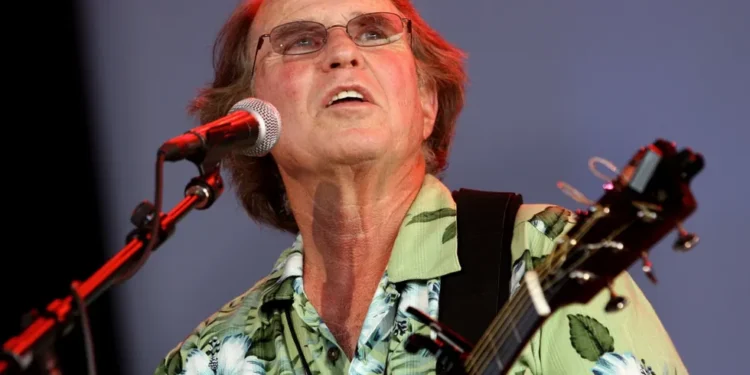 Country Joe McDonald performing anti-war anthem at Woodstock festival - AP Photo/Craig Ruttle, File