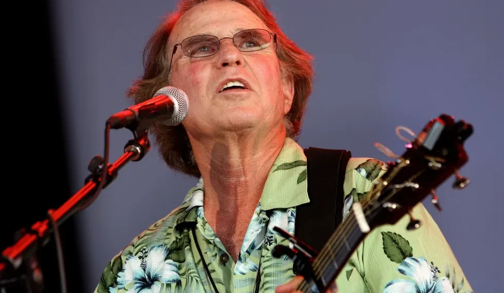 Country Joe McDonald performing anti-war anthem at Woodstock festival - AP Photo/Craig Ruttle, File