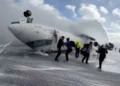 Overturned Delta regional jet on Toronto runway after landing failure - Peter Koukov/Handout/Reuters