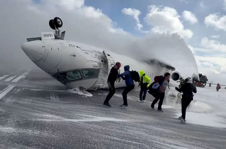 Overturned Delta regional jet on Toronto runway after landing failure - Peter Koukov/Handout/Reuters