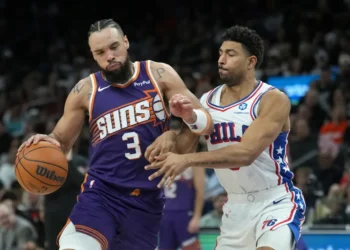 Dillon Brooks during Phoenix Suns game, injured hand visible - AP Photo/Ross D. Franklin