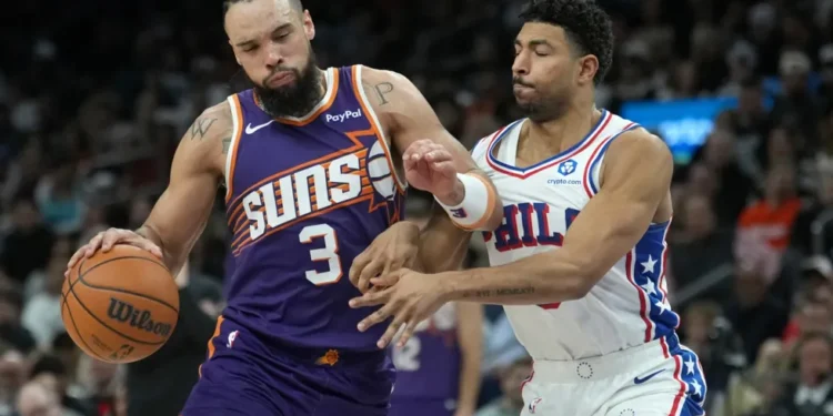 Dillon Brooks during Phoenix Suns game, injured hand visible - AP Photo/Ross D. Franklin