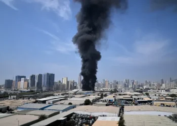 Smoke rises near Dubai skyline after missile interceptions - AP Photo/Altaf Qadri