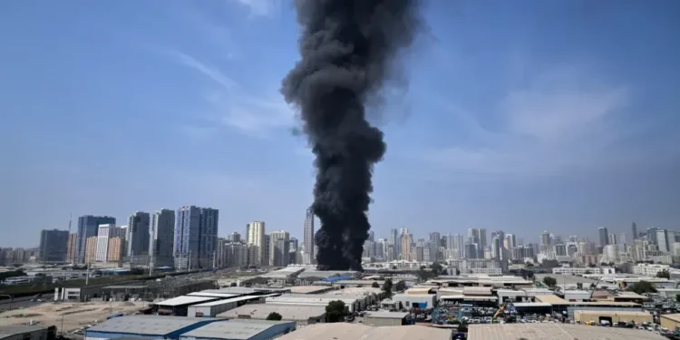 Smoke rises near Dubai skyline after missile interceptions - AP Photo/Altaf Qadri
