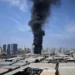 Smoke rises near Dubai skyline after missile interceptions - AP Photo/Altaf Qadri