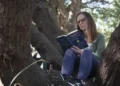 People practicing forest bathing in a calm urban green park - AP Photo/Allen G. Breed