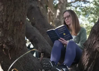 People practicing forest bathing in a calm urban green park - AP Photo/Allen G. Breed