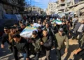 Hamas supporters carry coffins during funeral rally for commander killed in Gaza - REUTERS/Dawoud Abu Alkas