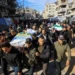 Hamas supporters carry coffins during funeral rally for commander killed in Gaza - REUTERS/Dawoud Abu Alkas