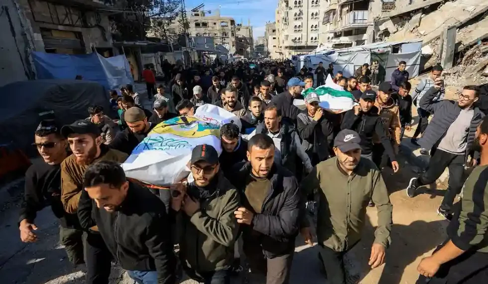 Hamas supporters carry coffins during funeral rally for commander killed in Gaza - REUTERS/Dawoud Abu Alkas
