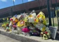 Memorial outside North Hall High School after Georgia teacher prank death incident - AP Photo/Emilie Megnien