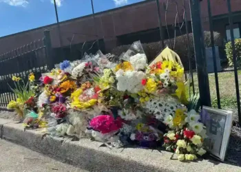 Memorial outside North Hall High School after Georgia teacher prank death incident - AP Photo/Emilie Megnien