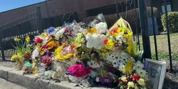 Memorial outside North Hall High School after Georgia teacher prank death incident - AP Photo/Emilie Megnien