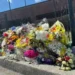 Memorial outside North Hall High School after Georgia teacher prank death incident - AP Photo/Emilie Megnien