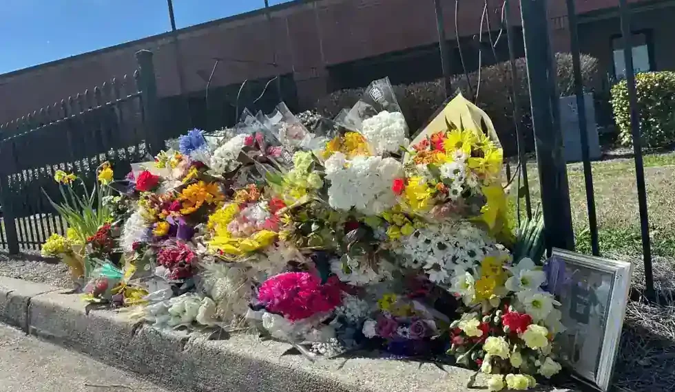 Memorial outside North Hall High School after Georgia teacher prank death incident - AP Photo/Emilie Megnien
