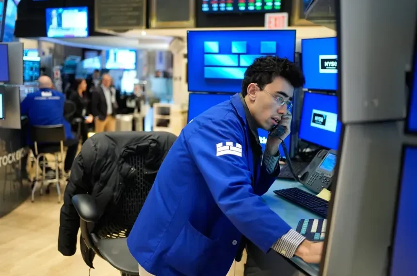 Oil barrels and stock market charts reflecting global price movements - AP Photo/Seth Wenig