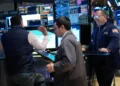 Traders monitor stock markets amid oil price volatility and global tensions - AP Photo/Seth Wenig