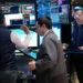 Traders monitor stock markets amid oil price volatility and global tensions - AP Photo/Seth Wenig