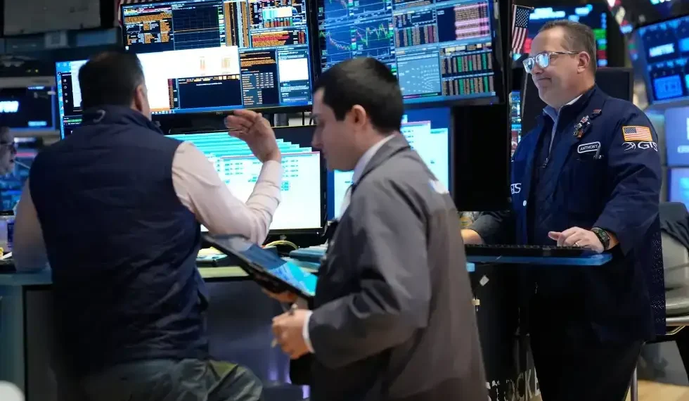 Traders monitor stock markets amid oil price volatility and global tensions - AP Photo/Seth Wenig