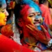 People throwing coloured powder during Holi festival in India - Getty Images