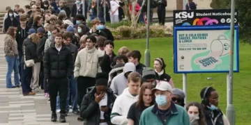 Students gather on campus amid meningitis outbreak response in Kent England - Gareth Fuller/PA via AP