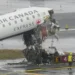 Damaged aircraft and fire truck after runway collision at LaGuardia Airport - AP Photo/Seth Wenig