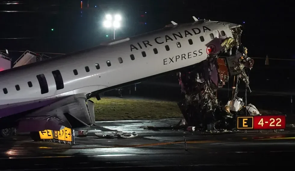 Damaged Air Canada regional jet after runway collision at LaGuardia Airport - AP Photo/Ryan Murphy