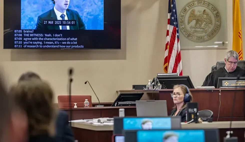 Meta logo representing child safety verdict and regulatory scrutiny - Jim Weber/Santa Fe New Mexican via AP, Pool