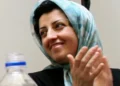 Nobel Peace Prize laureate Narges Mohammadi speaking at activist gathering in Iran - Vahid Salemi/AP News