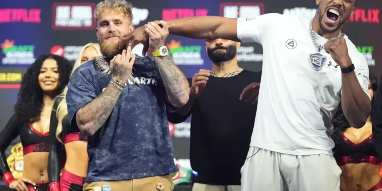 Jake Paul and Anthony Joshua facing off at Miami heavyweight weigh-in - AP Photo/Lynne Sladky