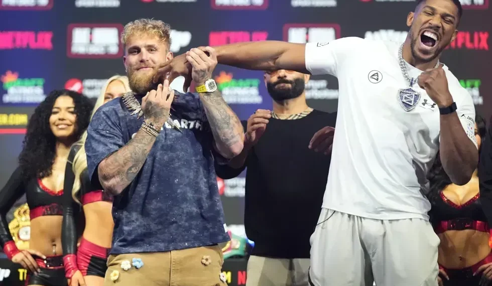 Jake Paul and Anthony Joshua facing off at Miami heavyweight weigh-in - AP Photo/Lynne Sladky