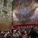 Choir performs during private Sistine Chapel concert beneath Michelangelo frescoes - AP Photo/Domenico Stinellis