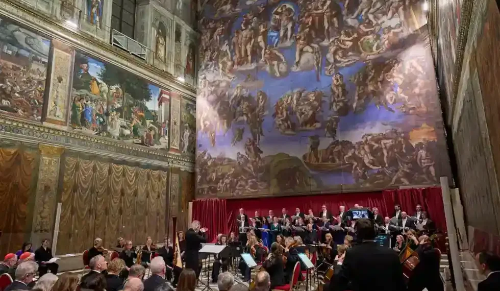 Choir performs during private Sistine Chapel concert beneath Michelangelo frescoes - AP Photo/Domenico Stinellis