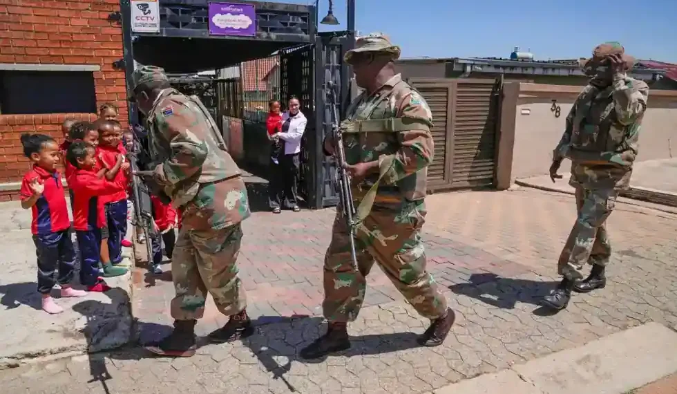 South African soldiers patrol Johannesburg streets during organized crime crackdown - AP Photo/Themba Hadebe