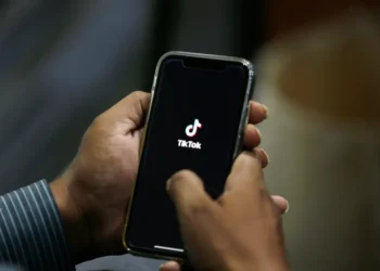TikTok logo displayed on smartphone as U.S. ownership restructuring deal announced - AP Photo/Anjum Naveed, File