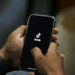 TikTok logo displayed on smartphone as U.S. ownership restructuring deal announced - AP Photo/Anjum Naveed, File